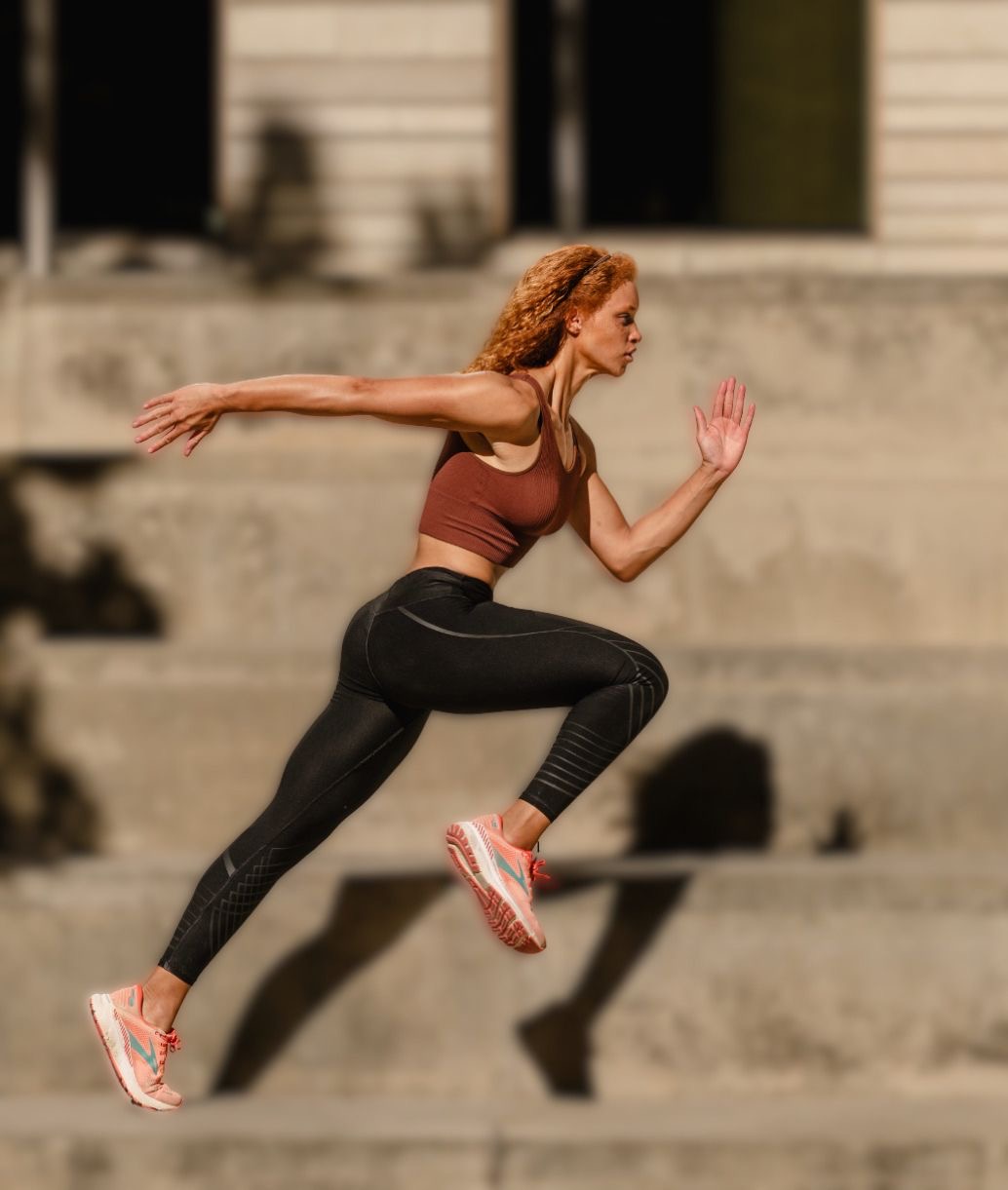 Juliana mid-sprint in athletic gear, driving forward with focus and power
